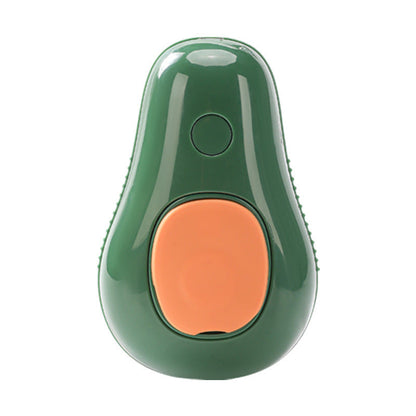 Green avocado-shaped pet grooming tool for removing loose hair and dander.